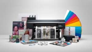 Modern digital printing machine producing colorful brochures, flyers, posters, and packaging with vibrant CMYK color palette.